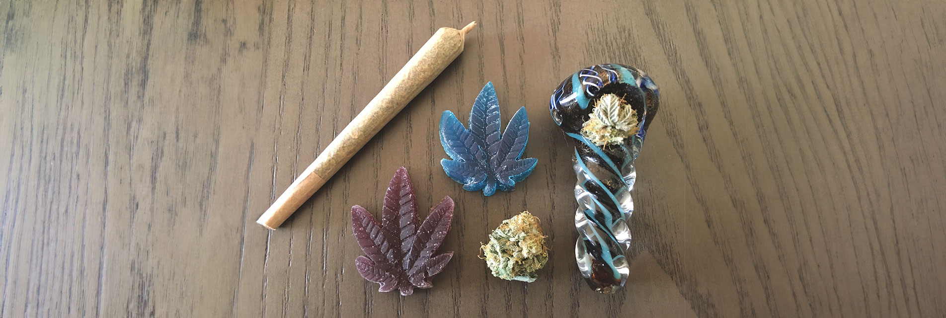 A variety of colorful pipes, a heap of CBD flower, and a step-by-step guide on packing and lighting the pipe on a nature-inspired background.